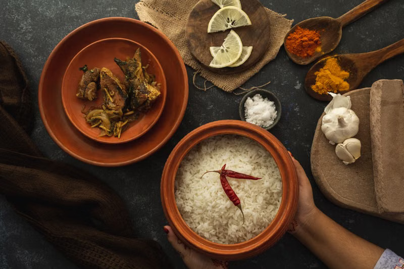 A traditional meal with rice and spices